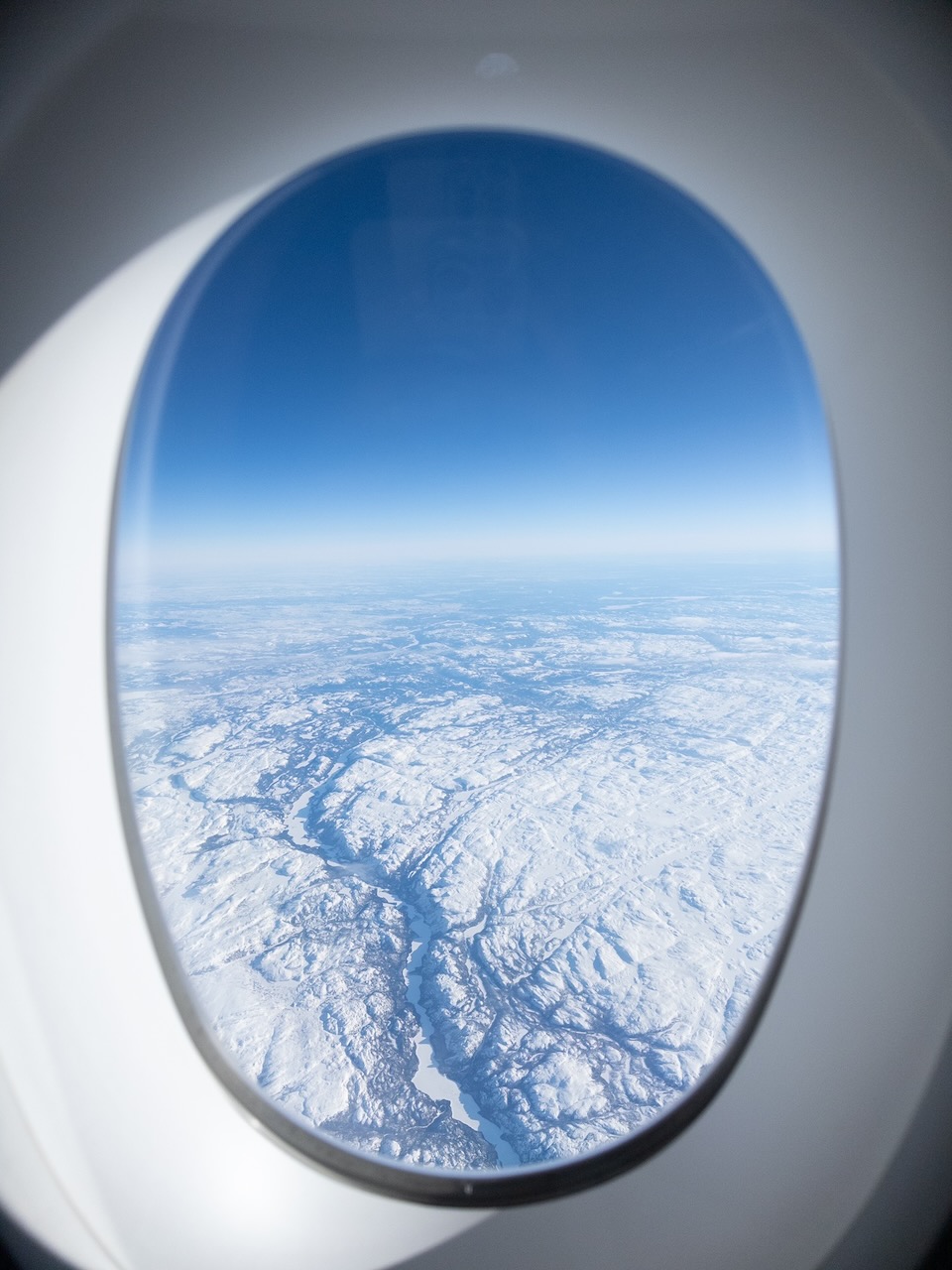 The textured surface of Greenland, as seen from Cathay Pacific CX812