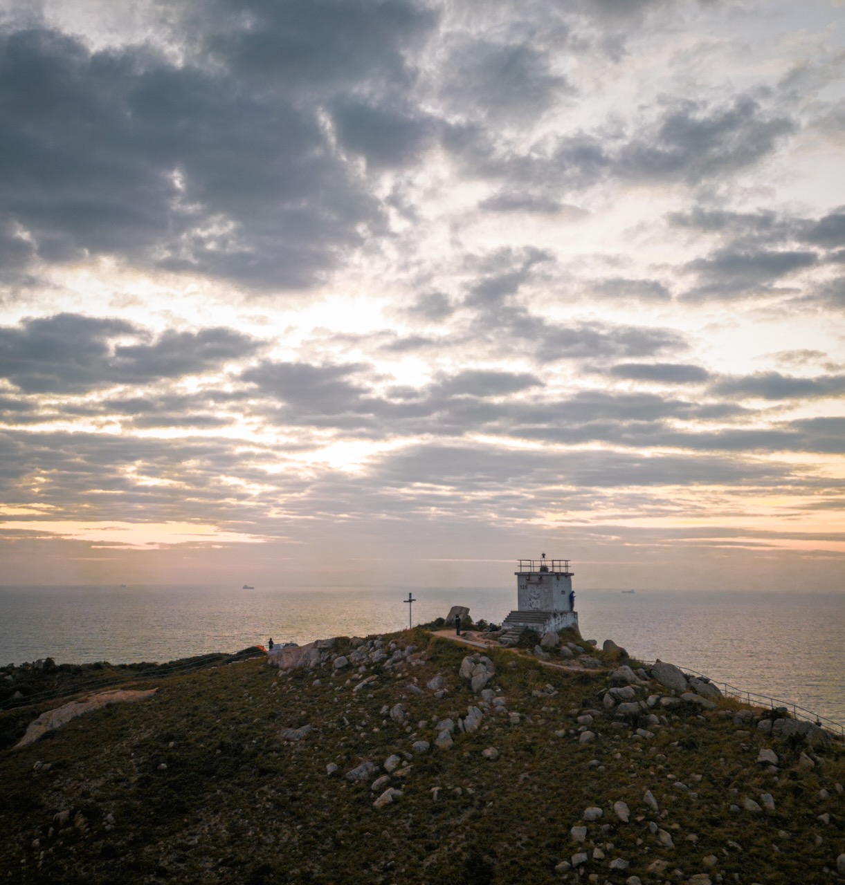 The Po Toi lighthouse at dawn, perched up on its hill